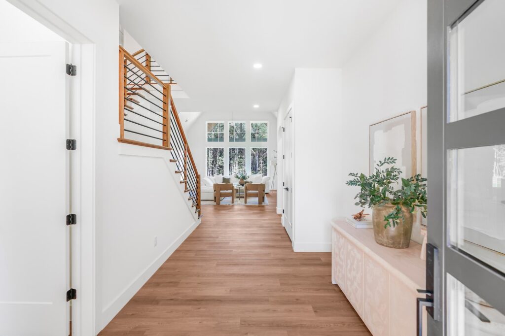 Entryway with cable-rail staircase in a Greenville semi-custom home